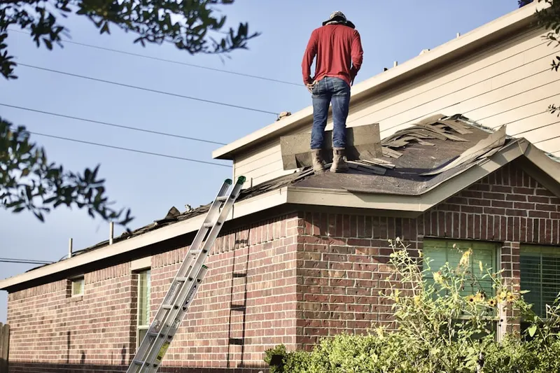Professional roofer working on a residential roof in Mountville Manor